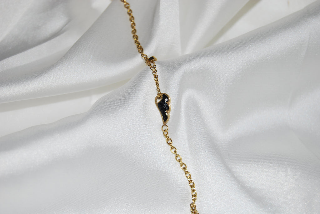 Pulseira com asas e zircónias pretas
